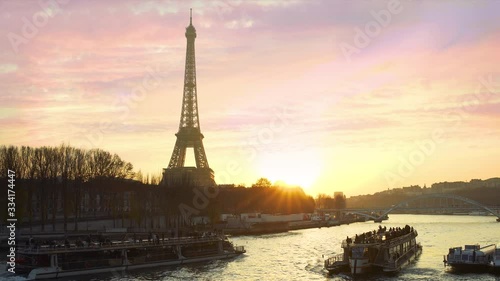 Paris, Tour boats on the Seine River at sunset
