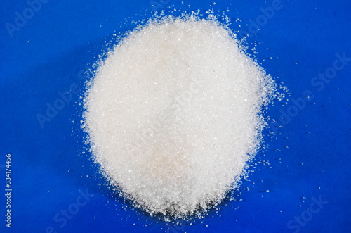 white sugar on a blue background.