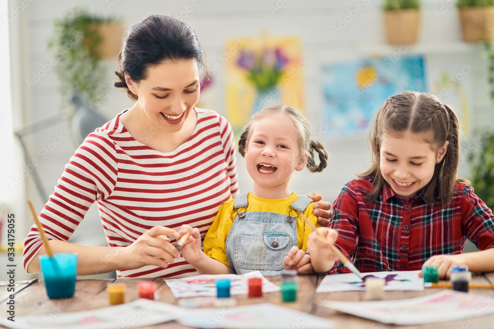 Happy family painting together. Happy family painting together.