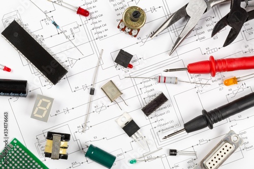 Different electronic parts or components on pcb wiring scheme with resistors, capacitors, diode and ic chips, flat lay top view from above