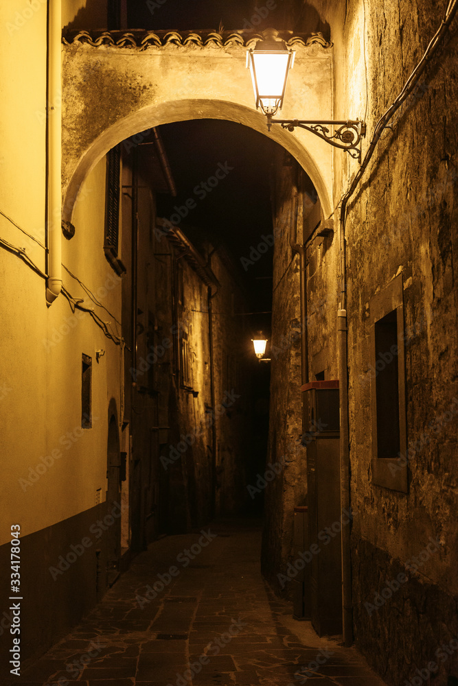 Narrow Alley With Old Buildings In Medieval Town , Tuscany, Italy