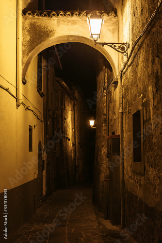 Narrow Alley With Old Buildings In Medieval Town   Tuscany  Italy