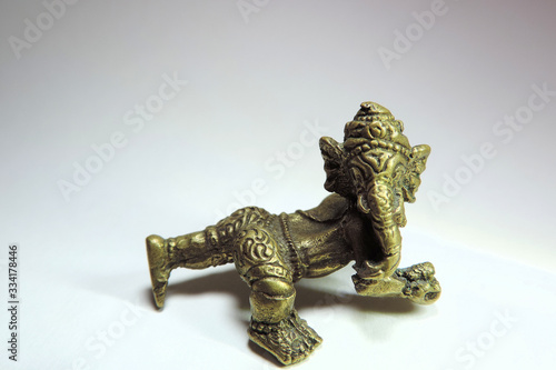 a small metal figure depicting the Hindu God Ganesha © ElenaEmiliya