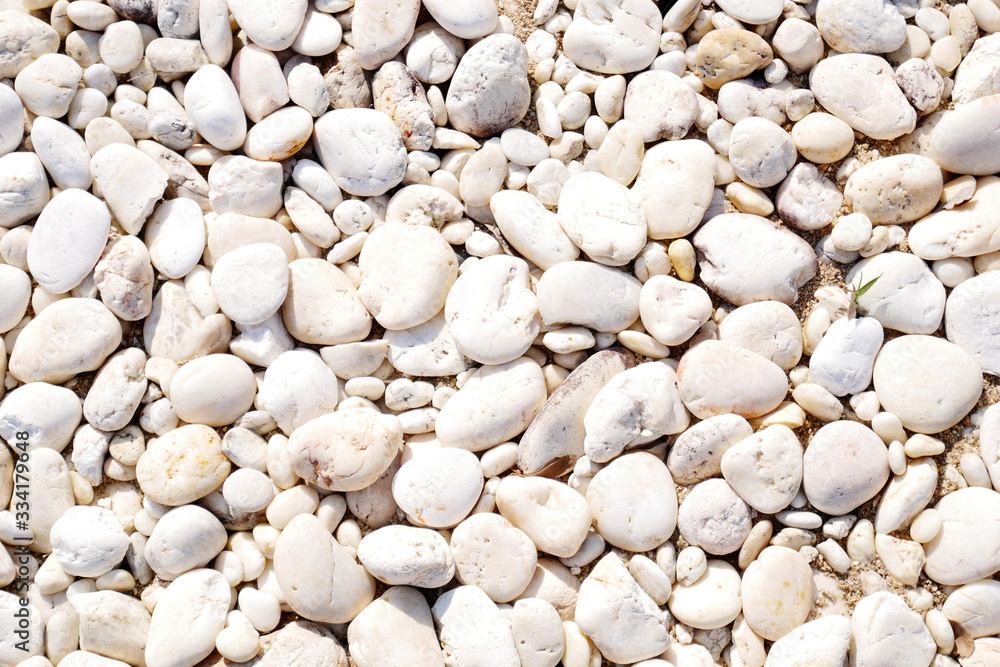 white pebbles on the beach stone background white pebbles on the beach stone background