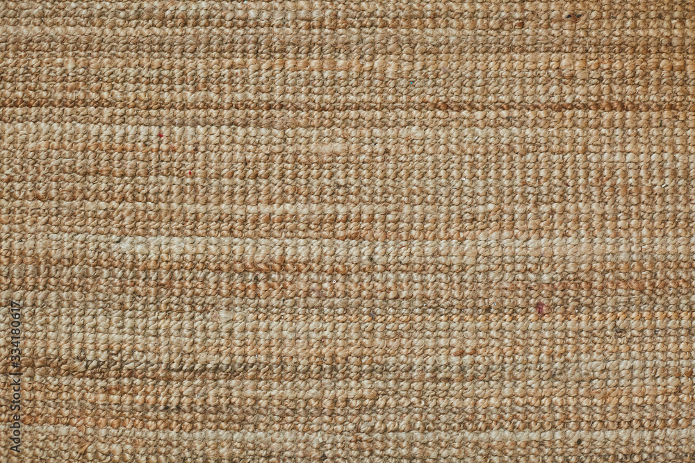 The surface texture of a natural Mat (straw, rope, or other natural material). The surface texture of a natural Mat (straw, rope, or other natural material).