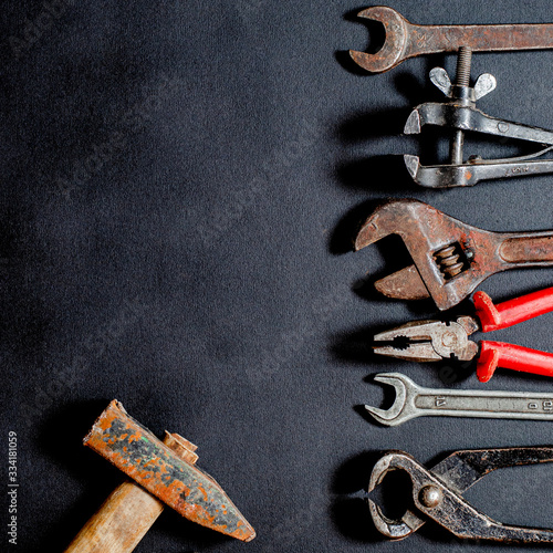 Tools for repair and reconstruction in home conditions lie on a black background
