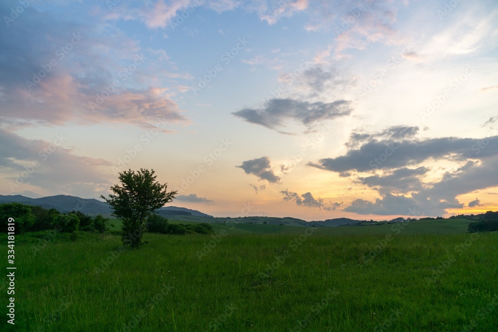 Plakat Sunrise or sunset over the hills and meadow. Slovakia