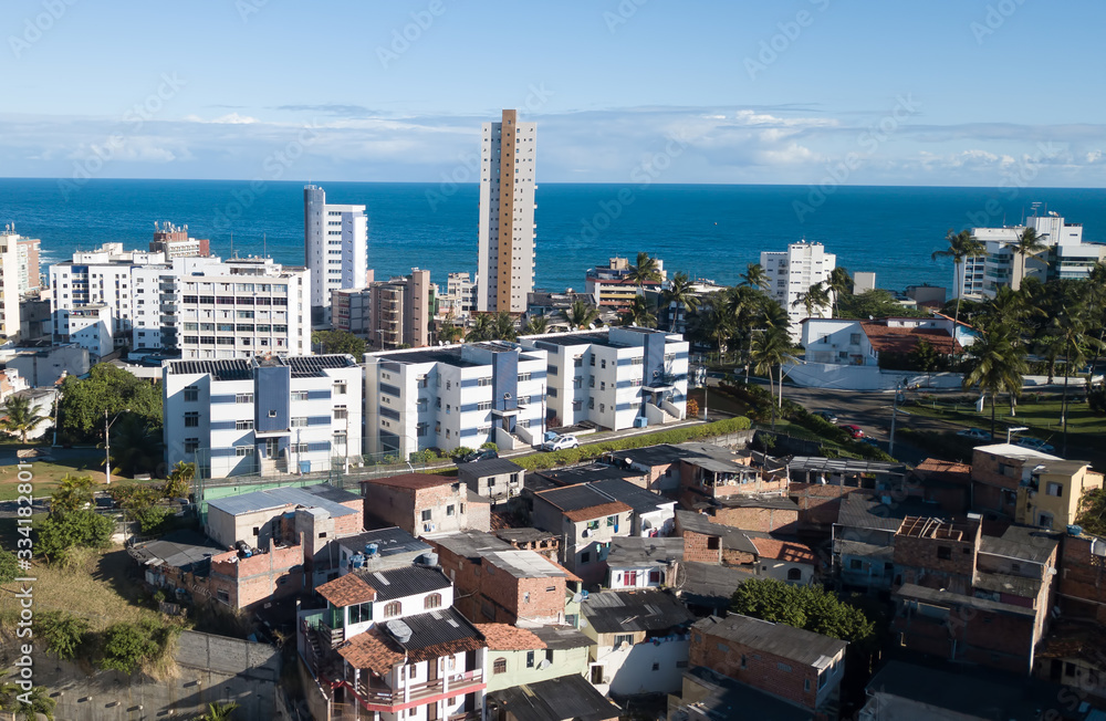 Fototapeta premium Urban social contrast. Slum and buildings.