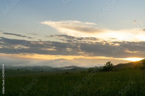 Sunrise or sunset over the hills and meadow. Slovakia