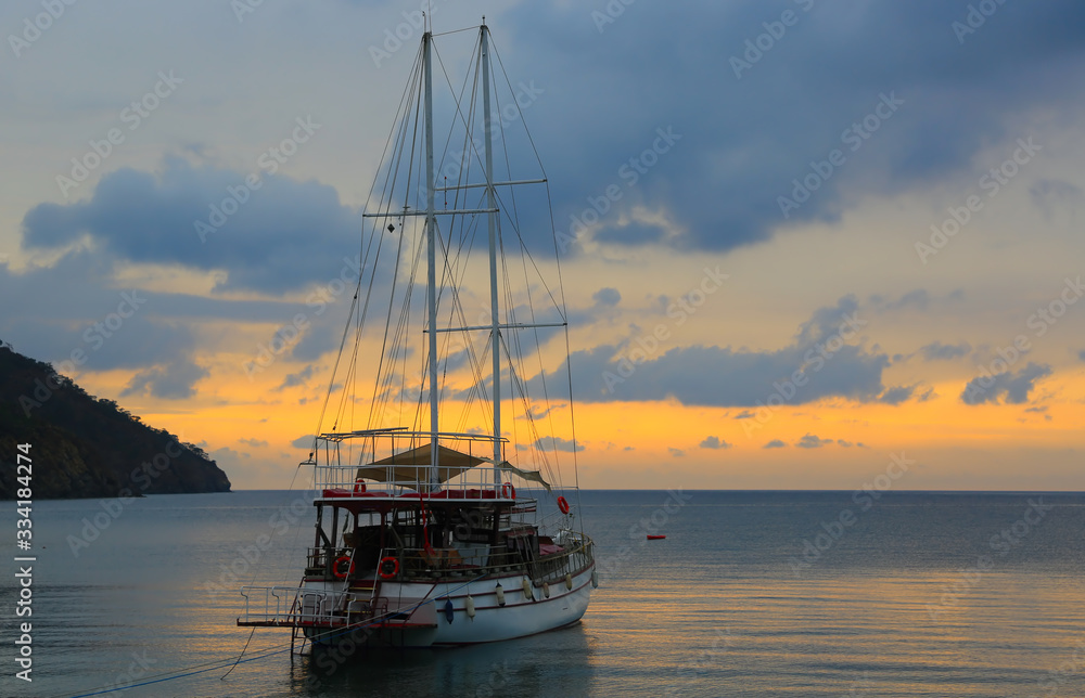 Morning landscape with a yacht at sea