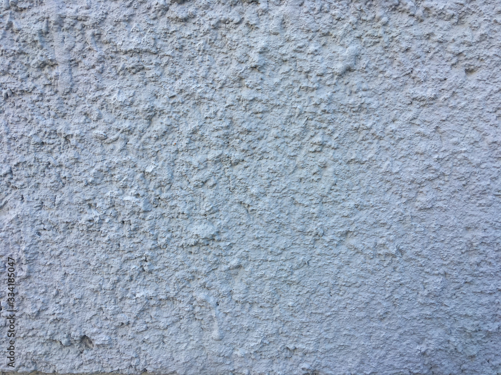Gray rough wall. Stucco texture for the background. Gray rough wall. Stucco texture for the background.