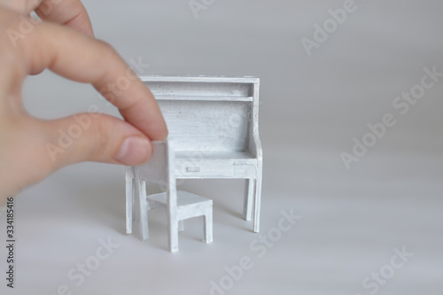 Miniature furniture made of cardboard, painted white