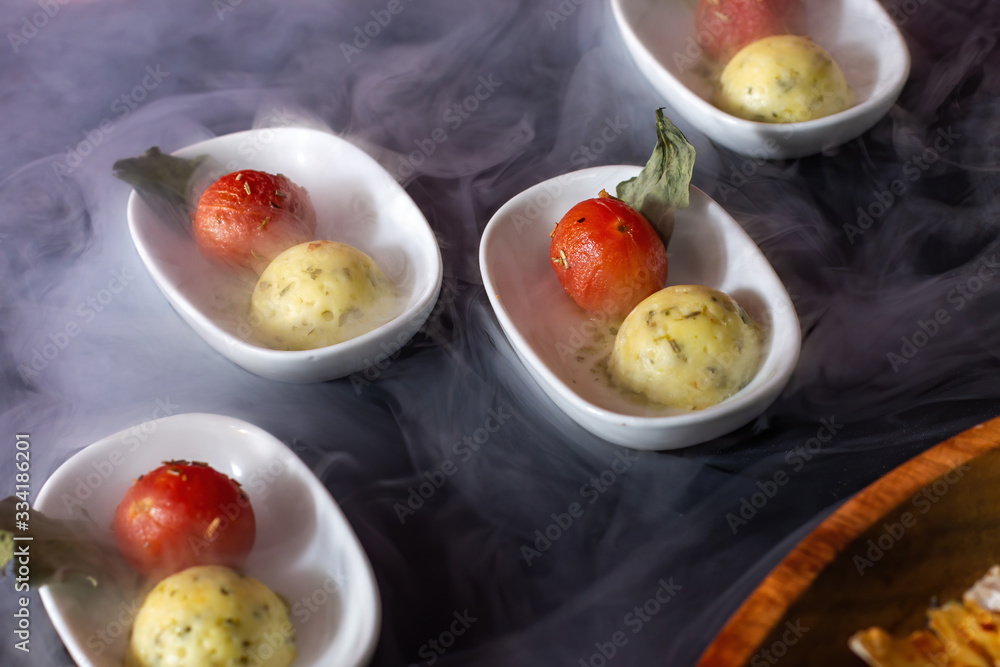 Snacks, ball-shaped fish paste with cherry tomatoes. Snacks, ball-shaped fish paste with cherry tomatoes.