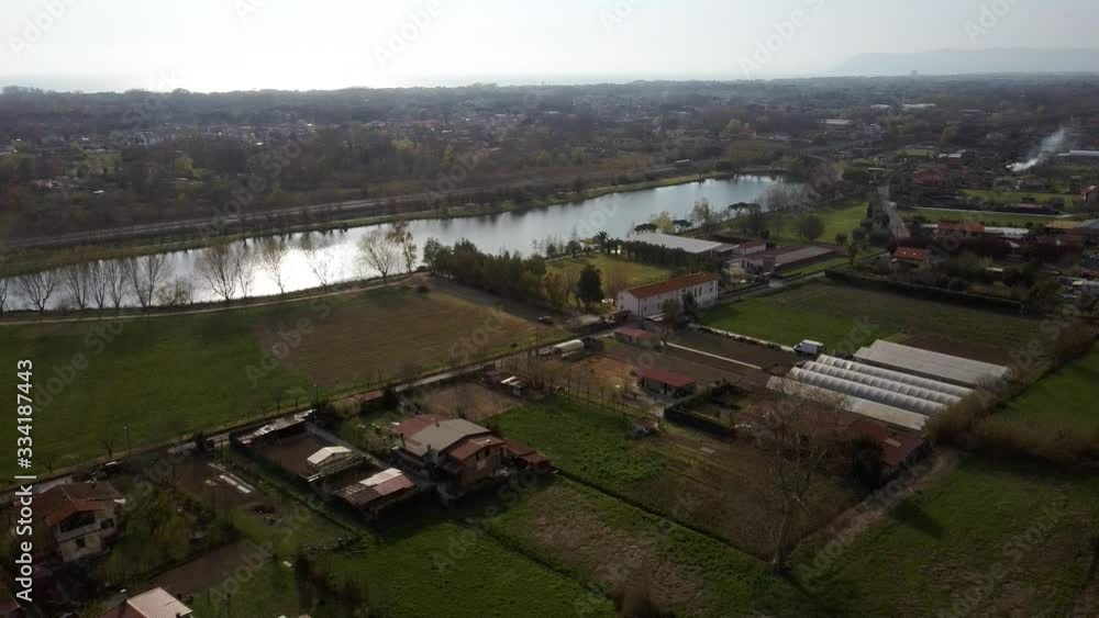 Relaxing aerial view of a lake with trees and a large green lawn Relaxing aerial view of a lake with trees and a large green lawn