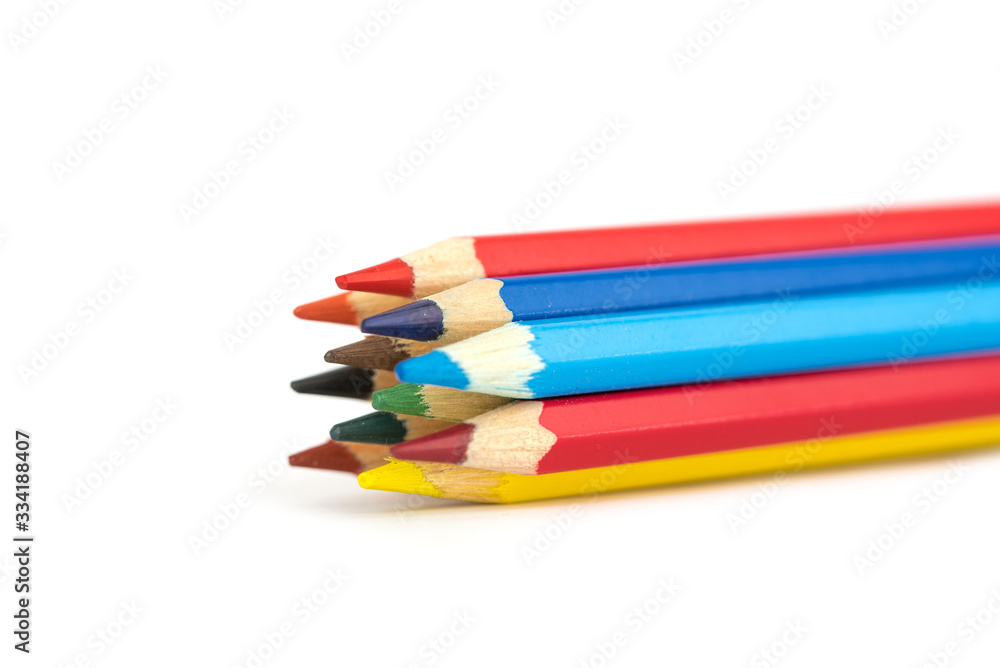 many colorful wooden crayons isolated on the white background many colorful wooden crayons isolated on the white background