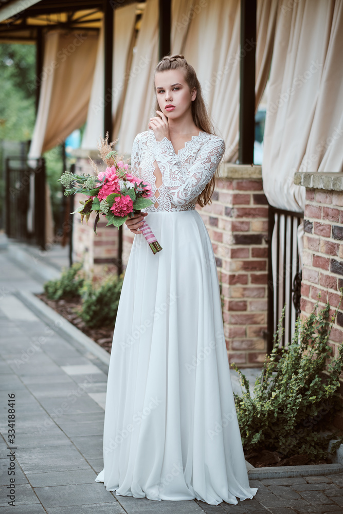 Portrait of young happy bride with bouquet Portrait of young happy bride with bouquet
