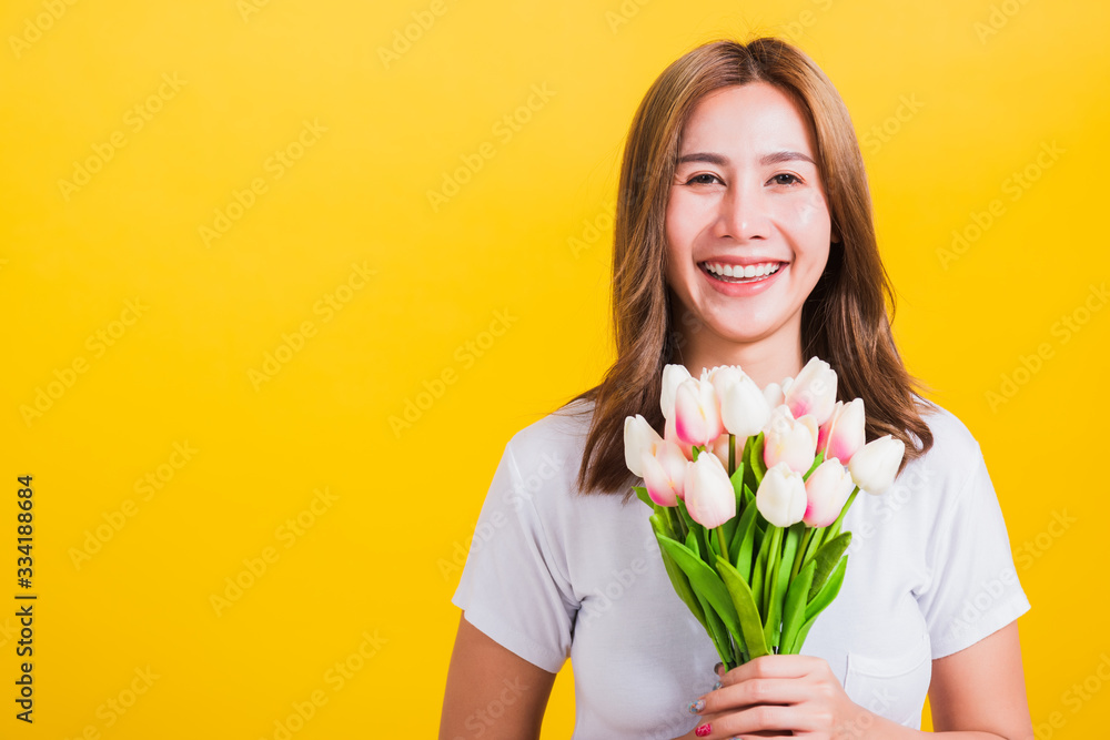 woman smiling, screaming excited hold flowers tulips bouquet in hands woman smiling, screaming excited hold flowers tulips bouquet in hands