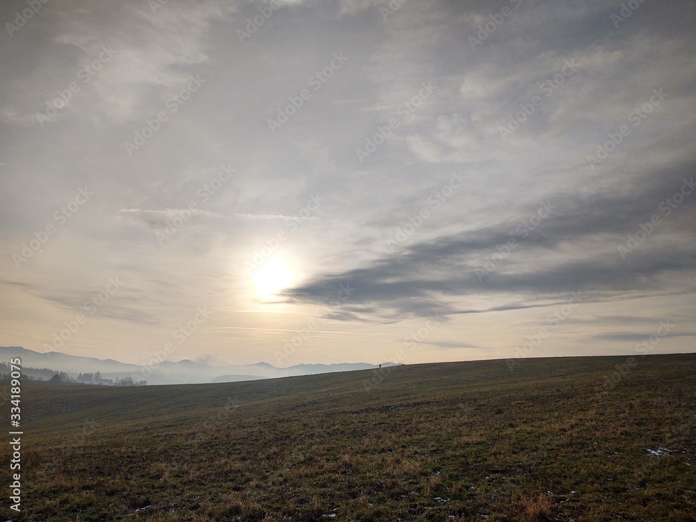 Fototapeta premium Sunrise or sunset over the hills and meadow. Slovakia 