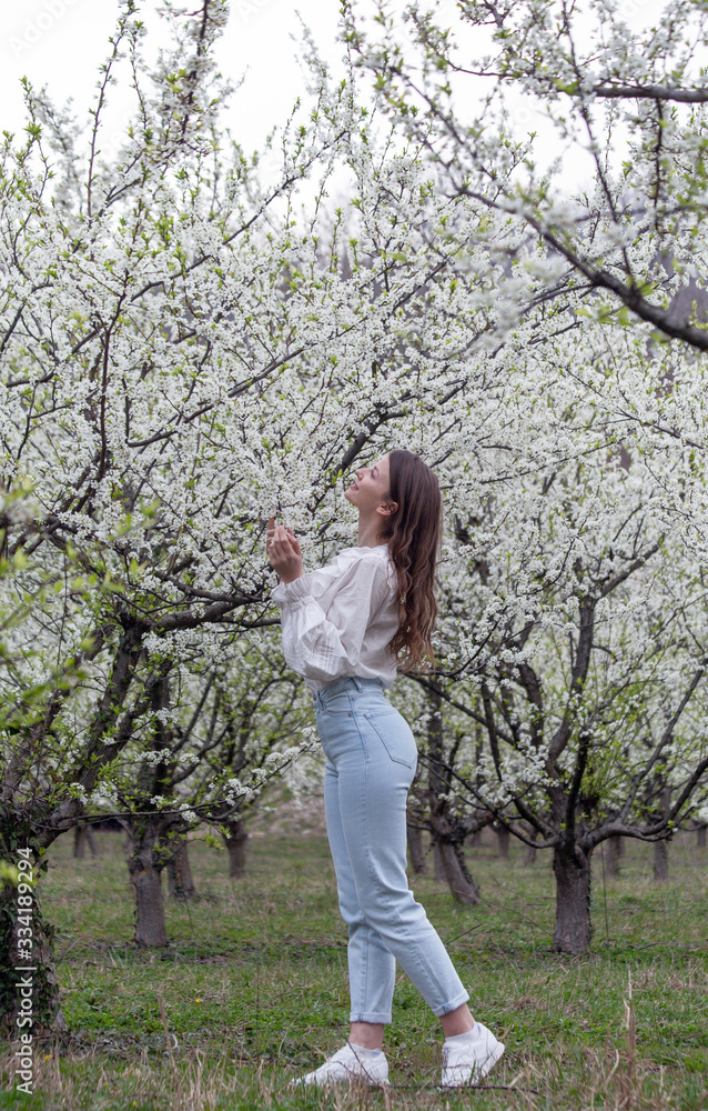 Beautiful girl in a flowered garden Beautiful girl in a flowered garden