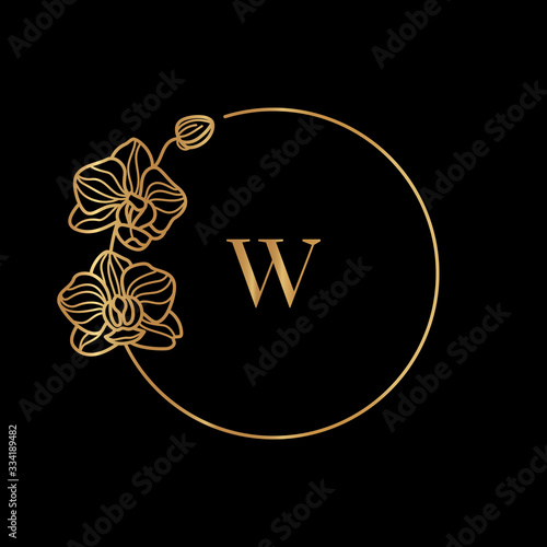 Gold frame template Orchid Flower and monogram concept with the letter W in minimal linear style. Vector floral logo