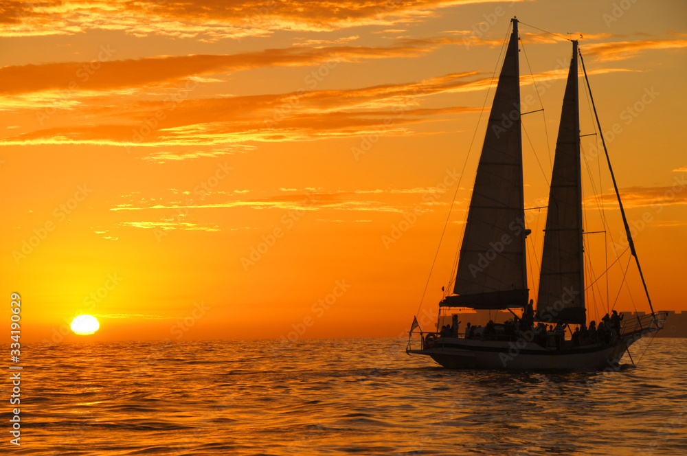 Beautiful sunset with a sailboat 