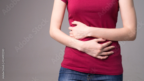 Pain In Stomach. Beautiful Young Woman Feeling Strong Abdominal Pain. Attractive Female Suffering From Painful Stomach Ache, Holding Hand On Belly. Digestion, Health Issues Concept. High Resolution