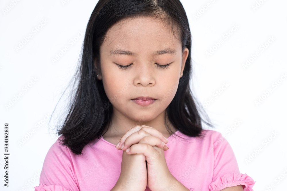 cute little girl praying. little girl praying in morning. hands folded in prayer concept for faith. spirituality and religion in front of the church..begging for forgiveness and believe in goodness. cute little girl praying. little girl praying in morning. hands folded in prayer concept for faith. spirituality and religion in front of the church..begging for forgiveness and believe in goodness.