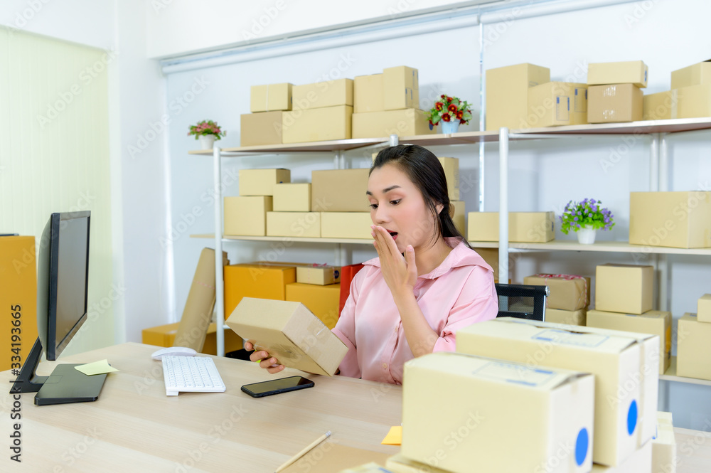 Beautiful young Asian woman online entrepreneur, woman selling products through online market place. Beautiful young Asian woman online entrepreneur, woman selling products through online market place.