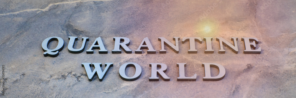 world quarantine , writen wooden letters on stone background world quarantine , writen wooden letters on stone background