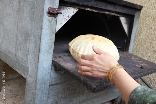 hands of baker with bread