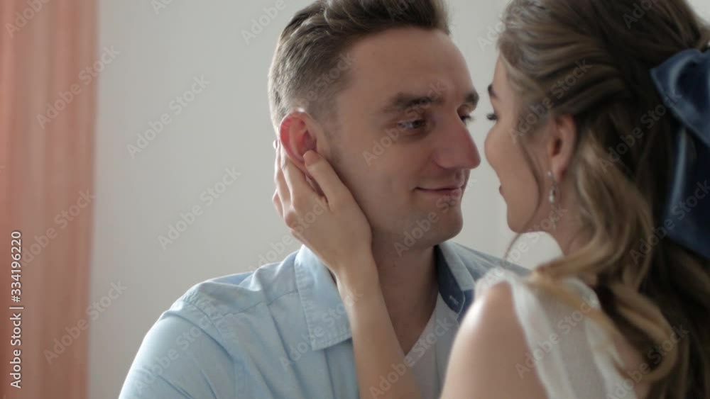 girl hugs a loved one and looks at him girl hugs a loved one and looks at him