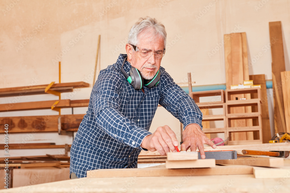 Experienced carpenter at the workbench Stock Photo Adobe Stock