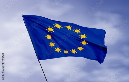 European Union flag flying in wind with Coronavirus (covid-19) virus icon