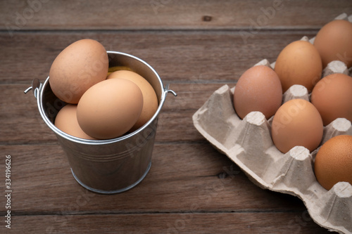  Eggs in a panel on a wooden floor