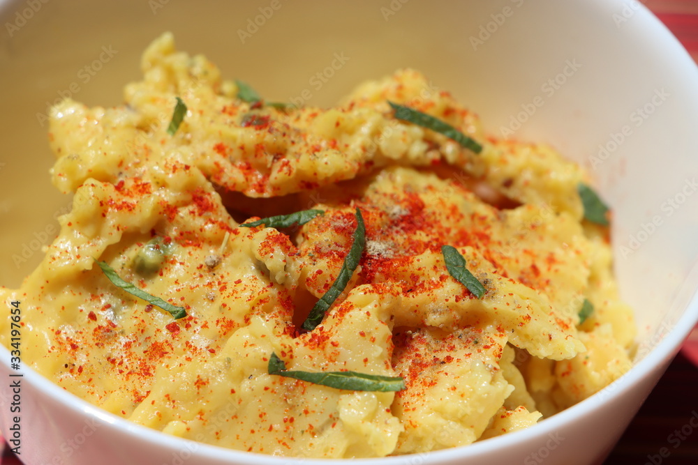 Jhunka or Zunka or pithale, a chickpea flour porridge, a vegetarian traditional Indian dish prepared in Maharashtra, Goa and Karnataka part of India Jhunka or Zunka or pithale, a chickpea flour porridge, a vegetarian traditional Indian dish prepared in Maharashtra, Goa and Karnataka part of India