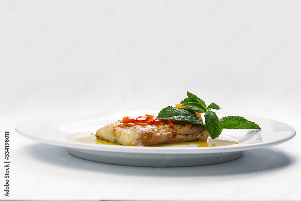 fish on a white plate fish on a white plate