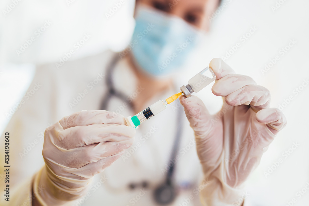 Doctor holding vaccine and syringe injection. It use for prevention,immunization. Doctor holding vaccine and syringe injection. It use for prevention,immunization.