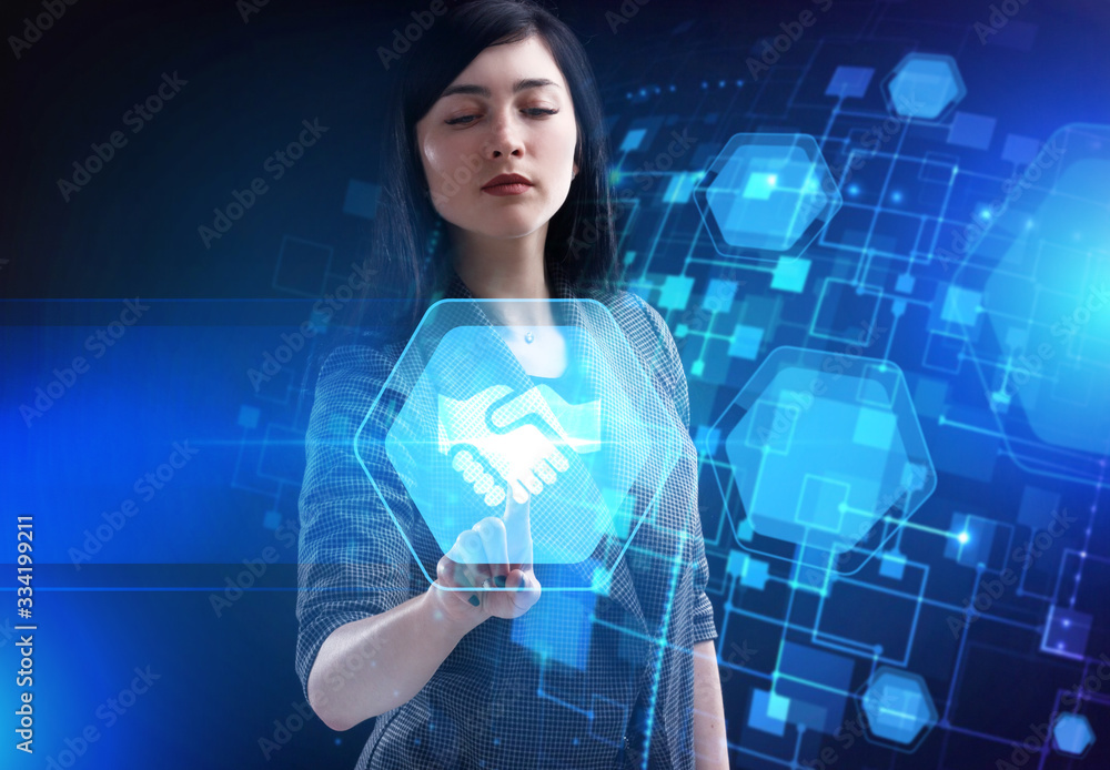 Business, Technology, Internet and network concept. Young businessman working on a virtual screen of the future and sees the inscription: Business, Technology, Internet and network concept. Young businessman working on a virtual screen of the future and sees the inscription:
