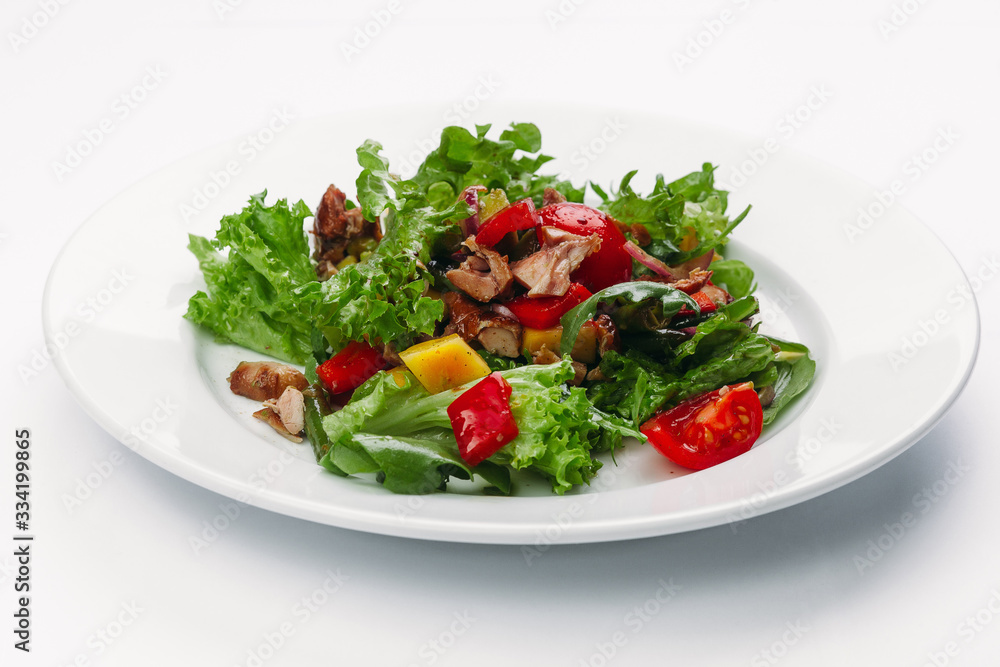 green salad on a white plate