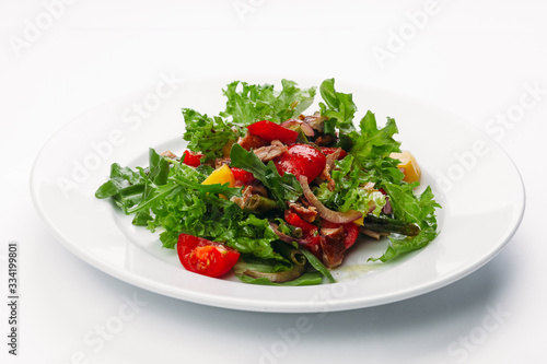 green salad on a white plate