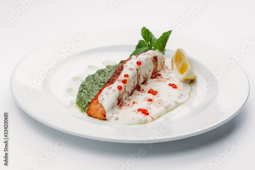 fish in white and green sauce