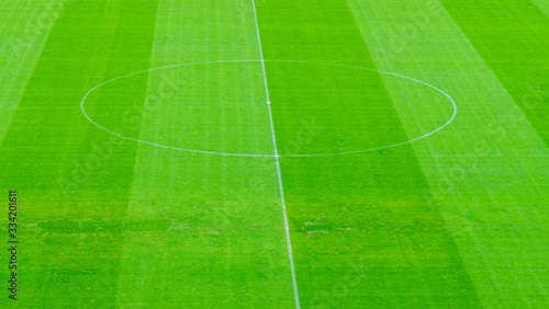 The soccer field with green grass. Beautiful natural background pattern. Sport concept.
