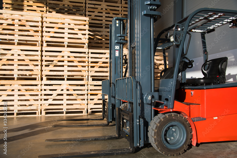 Forklift in a large warehouse for vegetable storage Forklift in a large warehouse for vegetable storage