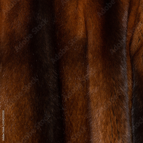 Natural dark brown shiny fur texture with beautiful folds in the form of waves © Павел Круглов