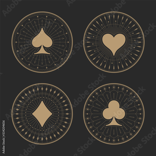 Playing cards suits icons with art deco frames. Old golden ornament patterns and casino symbols on dark background. The style of the 1920s - 1930s. Vector illustration.