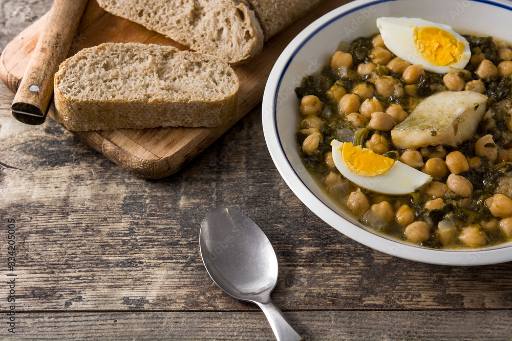 Chickpea stew with spinach and cod or potaje de vigilia. Typical spanish food for Easter holidays. Chickpea stew with spinach and cod or potaje de vigilia. Typical spanish food for Easter holidays.
