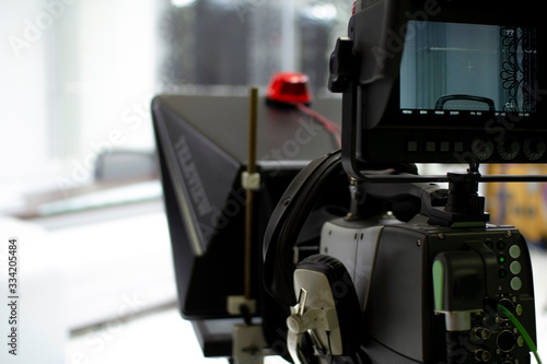TV camera in the Studio. Teleprompter and professional high-definition video camera on a tripod.