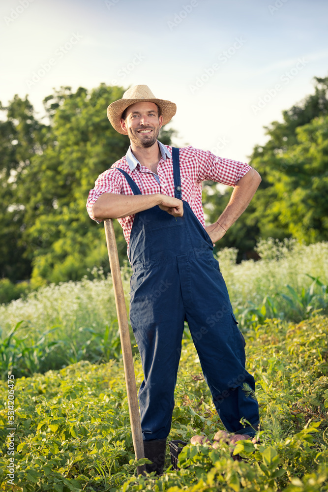 Sexy farmer with shovel. Stock Photo | Adobe Stock