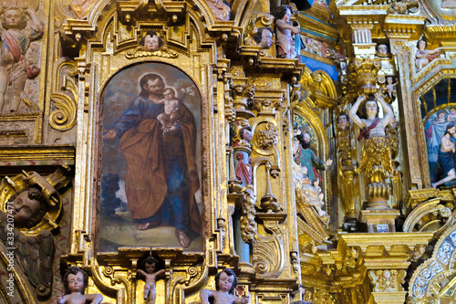 Close-up of a painting of Saint Joseph located in a column of a baroque style church