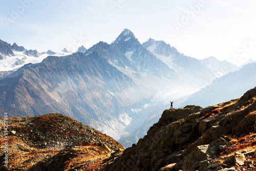 Amazing view on Monte Bianco mountains range with tourist on a foreground. Vallon de Berard Nature Preserve, Chamonix, Graian Alps. Landscape photography